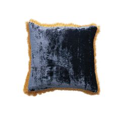 a blue velvet pillow with yellow trim