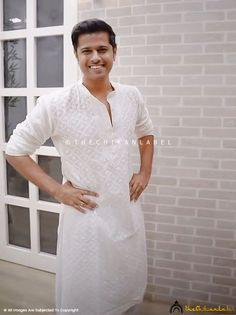 Neil Bhatt White Viscose Mens Chikankari Kurta The Chikan label Designer studio presents Neil Bhatt White Shaan Viscose Mens Chikankari Kurta. From Thechikanlabel, this kurta is a great way to show off your style. You'll look dapper as ever in this red piece paired with pajamas and sandals, ideal for any nice family gathering. If you are looking for formal kurtas for the winter season then look no further. This long kurta in cotton fabric is perfect for special occasions. Stylish and elegant sil Kurta Neck Design Men, Chikan Kurta For Men, Men Kurta Pajama Style, Kurta Neck Design For Men, White Chikankari Kurta For Men, White Kurta Designs For Men, Off White Kurta For Men, Men Kurta Designs Style, White Kurta Men