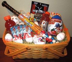 a basket filled with lots of different types of sports items and condiments on top of a table