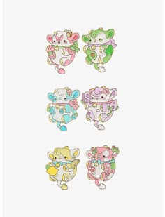 four different colored stickers with animals on them, one is white and the other has pink