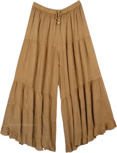 A relaxed pair of long solid khaki palazzo pants for the summer season. The huge flare gives it a feminine yet cool bohemian look, almost looks like a skirt with divided legs. You can mix and match the styles and wear them with tops of different colors. It has an elastic waistband and drawstrings for extra comfort. These casual summer day pants will go with every style and fashion. You can wear them with flats or heels. You can wear jewelry and accessorize yourself. The fabric is lightweight and Bohemian Summer Pants In Solid Color, Solid Bohemian Beach Bottoms, Bohemian Summer Pants, Bohemian Solid Color Wide Leg Pants For Vacation, Bohemian Style Solid Color Wide Leg Pants For Vacation, Solid Color Bohemian Wide Leg Pants For Vacation, Bohemian Solid Wide Leg Pants For Beach, Neutral Color Bohemian Wide Leg Pants For Beach, Bohemian Solid Color Harem Pants For Vacation