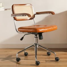 an office chair sitting on top of a hard wood floor