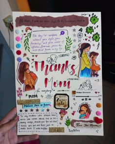 a person holding up a paper cutout with words and pictures on it that say thank you