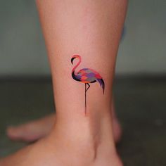 a flamingo tattoo on the ankle is shown in multicolored geometric shapes and lines