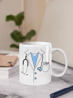 a white coffee mug with a stethoscope and doctor's coat on it