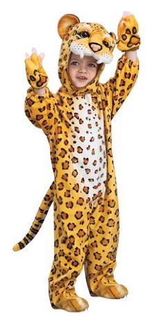 a child in a costume that has a tiger on it's head and is holding bananas