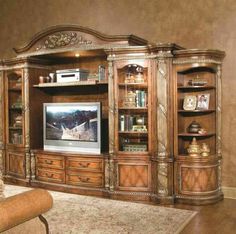 a living room with a large entertainment center