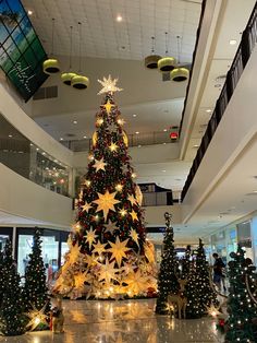 a large christmas tree in the middle of a mall