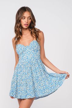 The Daniele Blue Floral Mini Dress will be your favorite summer dress! This cute blue floral mini dress is covered in blue and white floral print fabric supported by adjustable cami straps that connect to a bustier bodice with a plunging neckline. and corset-inspired seaming. Fitted waist tops a matching mini skirt finishes the look of this blue floral dress. Partially lined. DETAILS & CARE 100% Rayon/LINING: 100% Polyester. Machine wash cold. Imported. Blue Floral Mini Dress - Where to Wear A f Blue Floral Mini Dress, White Floral Mini Dress, Cute Floral Dress, Blue Floral Print Dress, Cute Floral Dresses, Dress With Corset, Boho Pink, Blue Floral Dress, Corset Mini Dress