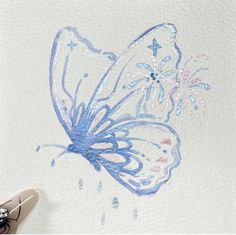 a drawing of a blue butterfly on white paper