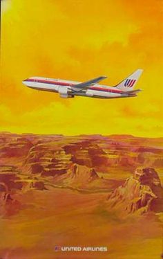 an airplane is flying over the desert with mountains in the back ground and yellow sky