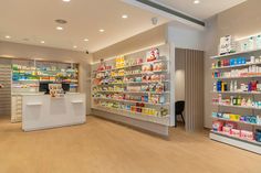 the inside of a pharmacy store with shelves full of medicines