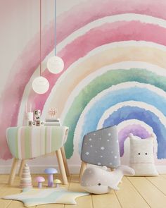 a child's room decorated in pastel colors with rainbow painted on the wall