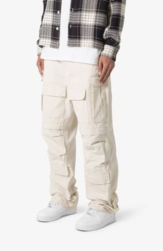 The ultrabaggy fit of these nonstretch cotton pants lets you move with ease all day long, while the cargo pockets keep all your essentials close at hand. 32 1/2" inseam; 9 1/2" leg opening Zip fly with button closure Front scoop pockets; cargo flap-patch pockets; back patch pockets 100% cotton Machine wash, tumble dry Imported Urban Cotton Cargo Pants With Pockets, Urban Style Cotton Cargo Pants With Pockets, Baggy Parachute Pants With Cargo Pockets And Tapered Leg, Utility Cotton Parachute Pants Full Length, Casual Cotton Parachute Pants With Multiple Pockets, Urban Cotton Pants With Pockets, Relaxed Fit Parachute Pants With Multiple Pockets, Full-length Cotton Cargo Pants With Hip Pockets, Relaxed Fit Full-length Cotton Cargo Pants