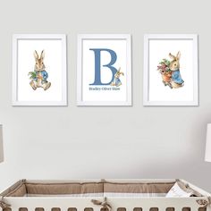 a baby's nursery room with two pictures on the wall and a crib