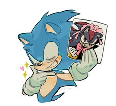 sonic the hedgehog holding up a photo