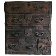 an old wooden chest with metal handles and knobs