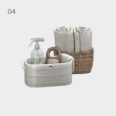 two baskets with towels, soap and lotion in them next to each other on a white background