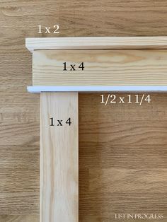 two pieces of wood sitting on top of each other with measurements for the length and width