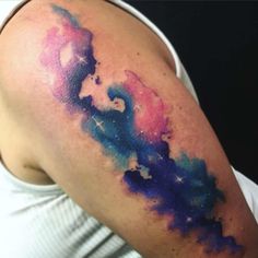 a person with a colorful tattoo on their arm