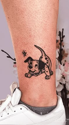 a small dog tattoo on the ankle