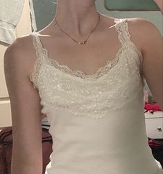 Coquette white lace tank top White Tank Top Coquette, Lace Lined Tank Top, Lacey White Top, Lace Undershirt Tanks, Coquette Lace Top, White Vintage Lace Top, Lacy Undershirt, White Lace Tank Top Outfit, White Tank Top Aesthetic