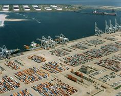 an aerial view of a large port with many containers