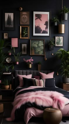 a bedroom with black walls and pink bedding, potted plants and pictures on the wall