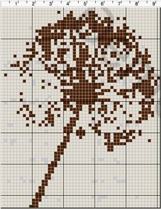 a cross stitch pattern with a flower in the center and an arrow on it's side