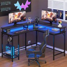 a computer desk with two monitors and a gaming keyboard on it, in front of a window