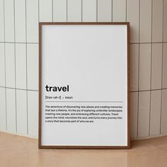 there is a framed poster on the wall next to a tiled wall with words that read travel