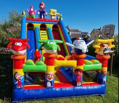 an inflatable bounce house with characters on it