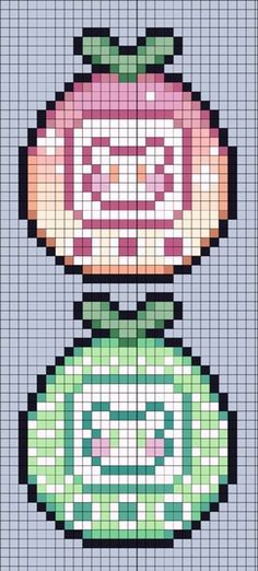 a cross stitch pattern with an image of a flower in the center and two flowers on top