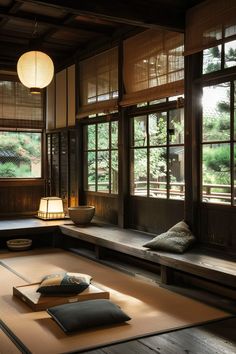 an empty room with tatami mats and lamps on the floor in front of large windows