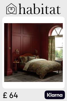 a bed room with a neatly made bed next to an open window and a red wall