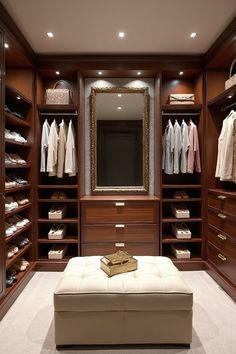 Experience the ultimate in closet organization and design. This luxurious space features custom walnut shelving, soft LED lighting, and a harmonious color palette, creating a serene and sophisticated atmosphere. Closet Ottoman Walk In, Closet Custom, Patterned Wallpaper, Walk In Closet Design, Light Highlights, Length Mirror, Full Length Mirror, White Led Lights