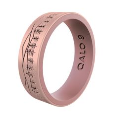 a pink wedding ring with the names of people on it and an image of trees