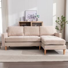 a living room scene with focus on the sectional sofa and coffee table in the foreground