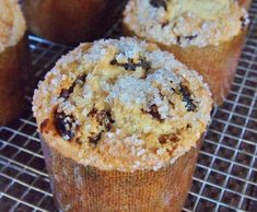 several muffins cooling on a rack with some oatmeal crumbs