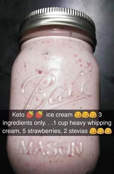 a jar filled with ice cream sitting on top of a table