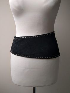 Vintage wide belt made of suede leather - asymmetrical with metal studs. From the 80s or 90s. Good vintage condition. No flaws that I could see. Mannequin is roughly 25 waist Wide Black Belt, Party Belts With Rivets, 2024 Predictions, 1950s Boys, 80s Belt, Beach Jacket, Belt Making, Digital Wardrobe, Studded Belt