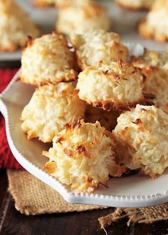 some biscuits are on a white plate with red napkins in the backgroud