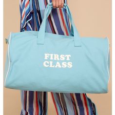 New Ban.Do First Class Light Blue Getaway Duffle Bag You Need A Vacation And There's No Better Reason To Get Outta Town Than Our Insanely Cute Getaway Duffle Bag. And Yes, All Of Your Stuff Will Fit - This Bag Is Huge! Measures 12.5” X 21.5” X 12.5” Heavyweight 16 Oz. Canvas Leatherette Handle Cover & Bottom Panel Cotton Lining 47” Removable/Adjustable Shoulder Strap Zipper Closure Inside Slip Pocket New Without Tags With Plastic Tagger Tail Intact Sporty Travel Bags For Spring, Blue Weekender Bag With Large Capacity, Blue Tote Bag For Weekend, Casual Blue Tote Travel Bag, Casual Blue Duffle Bag For School, Sporty Summer Weekend Bag, Trendy Blue Travel Bag With Large Capacity, Trendy Blue Large Capacity Travel Bag, Blue Casual Tote Duffle Bag