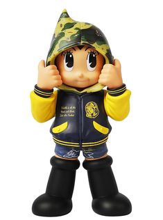 a toy figurine is wearing a jacket and hat with his hands up in the air