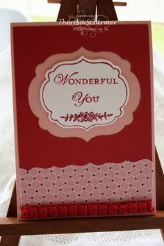 a card with the words wonderful you written on it and an easel holding some cards