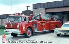 two fire trucks parked in front of a building