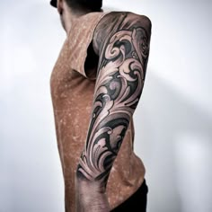 a man with a tattoo on his arm