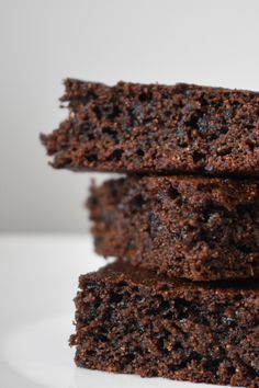 three chocolate brownies stacked on top of each other