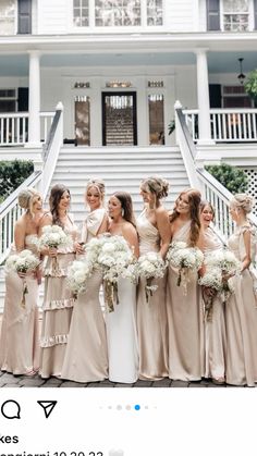 a group of women standing next to each other in front of a white house with stairs