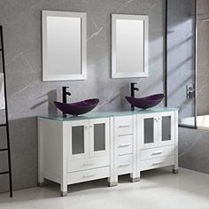 a bathroom with two sinks and mirrors on the wall